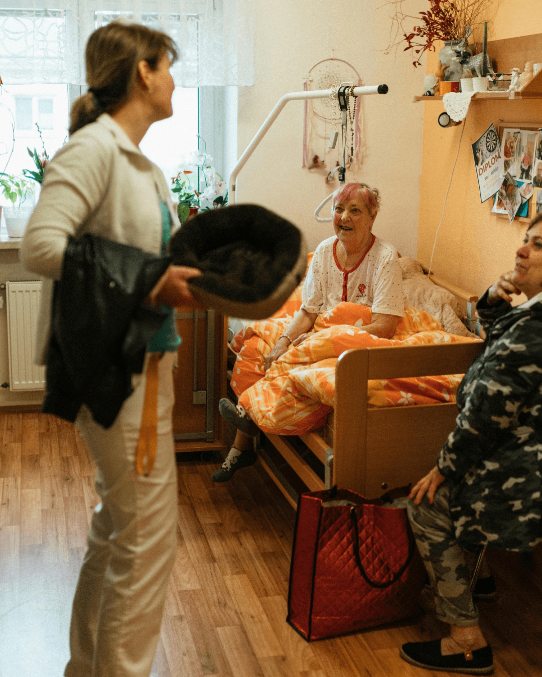 Home nurse giving prescribed medicines to patient at home