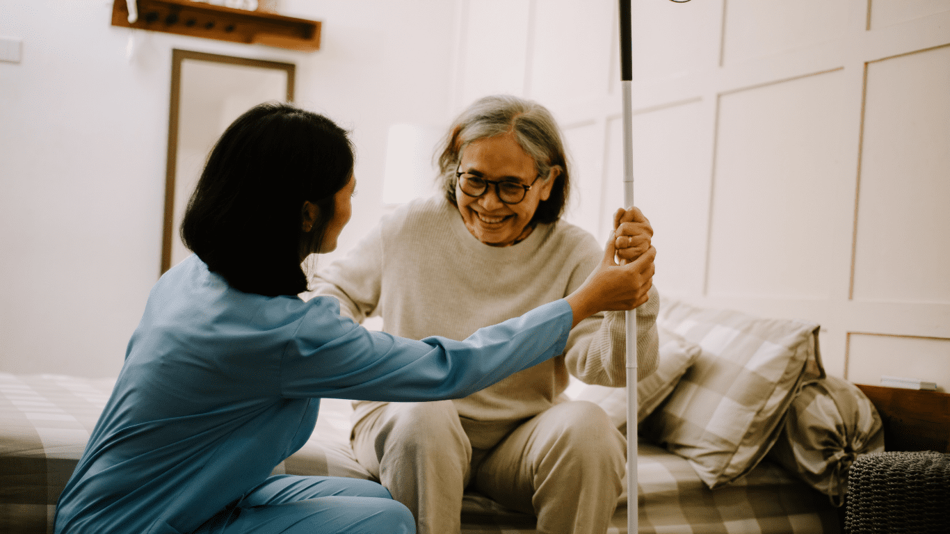 Home nurse checking patient’s blood pressure in Delhi